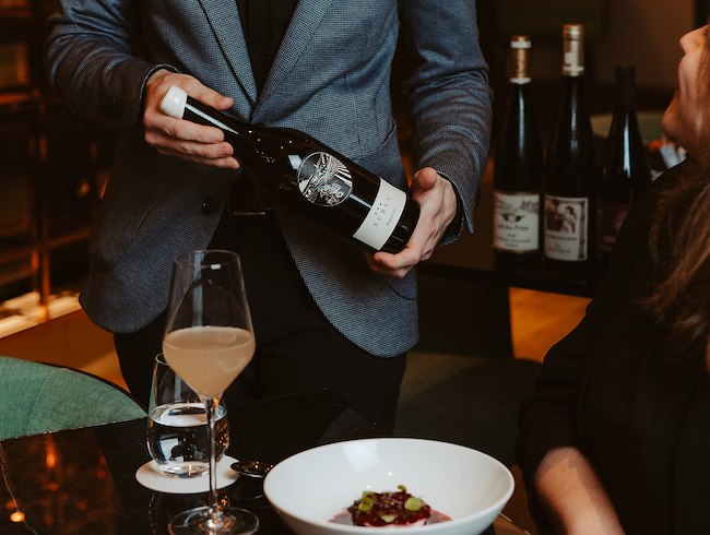 sommelier selecting wine